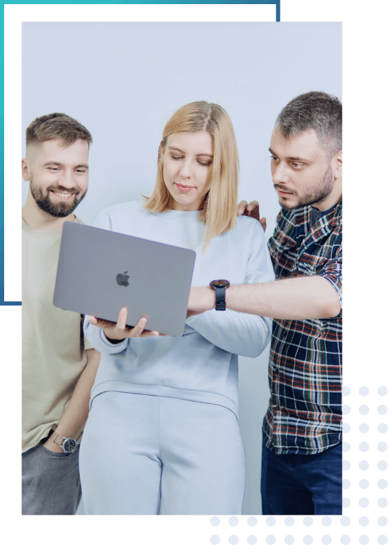 3 people looking at a laptop