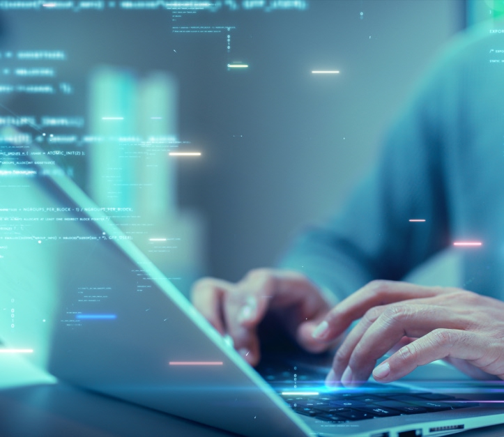 Human hands typing at a laptop